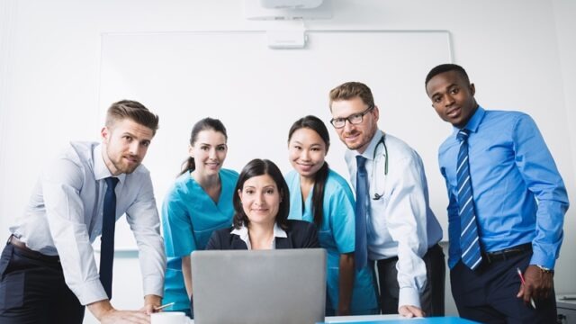 Portrait of doctors smiling in conference room